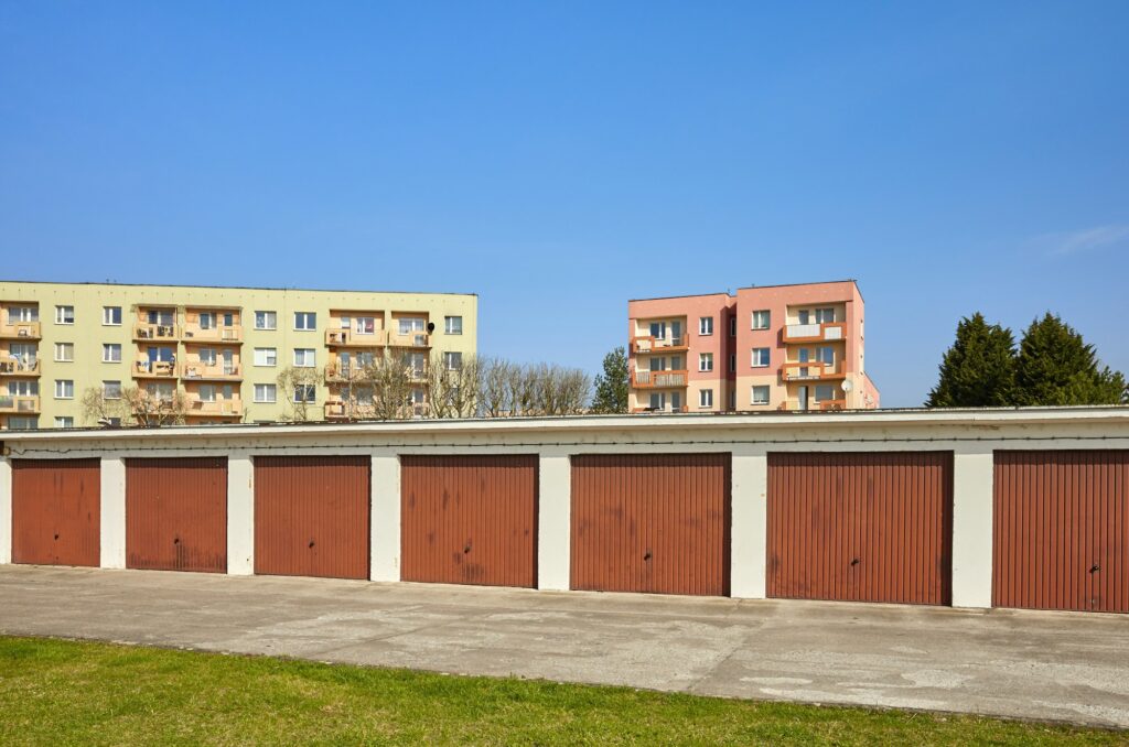 Garages with closed gates in a residential neighborhood.